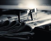 Glasses-on-newspapers.jpg